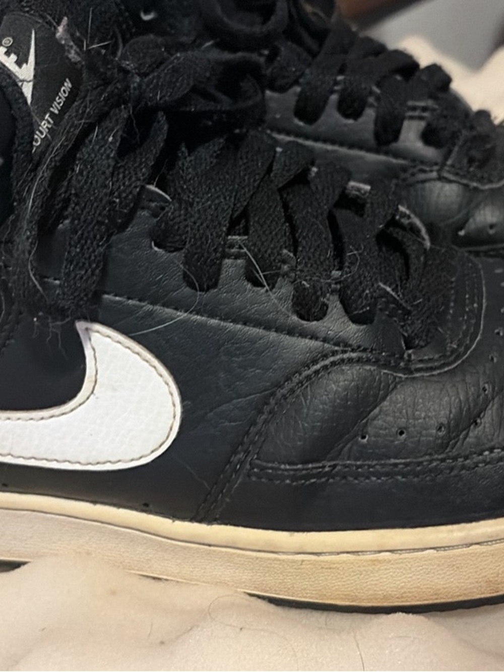 Nike Black Leather Sneakers with White Swoosh and Cream Midsole